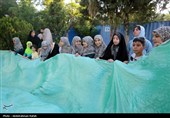 اهتزاز پرچم مزین به نام علی ولی الله (ع) بر فراز شهر همدان